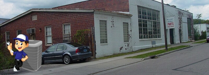 Car parked in front of brick building in Reading, OH